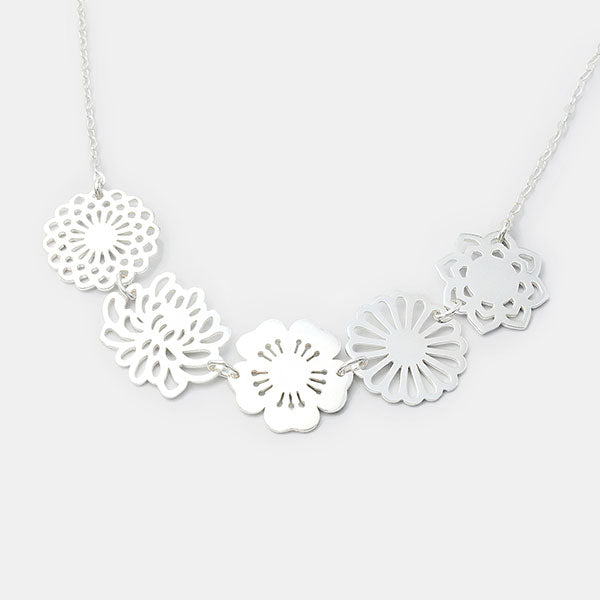 Bouquet statement necklace in sterling silver with dahlia, cherry blossom, chrysanthemum, daisy and lotus flowers by Australian jeweller Simone Walsh