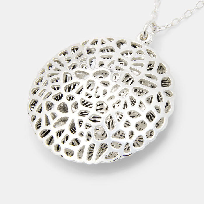 Coral reef open locket in sterling silver