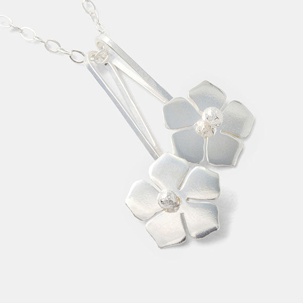 Forget-me-not flowers pendant necklace in sterling silver.