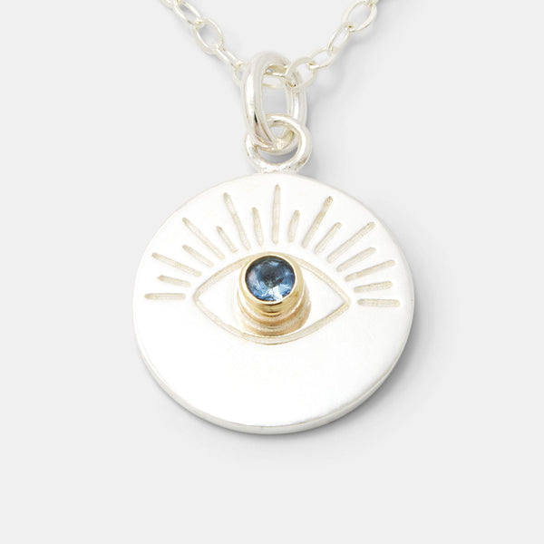 Necklace with pendant in gold and silver, including our evil eye amulet.