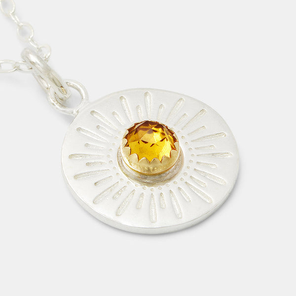 Sterling silver sunburst amulet pendant with citrine gemstone and solid gold setting